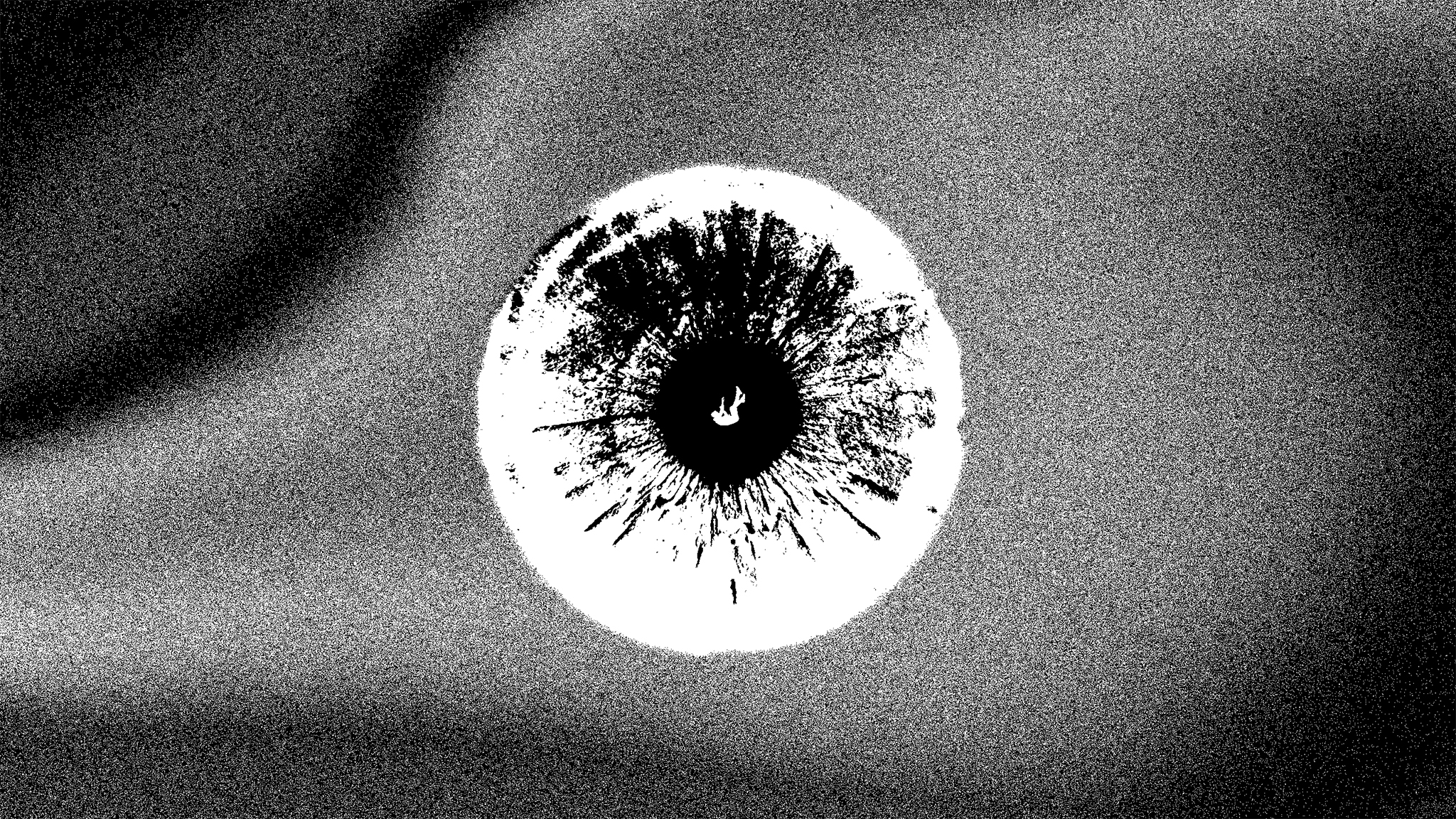 Composizione grafica in bianco e nero con un’iride luminosa e una figura in caduta.